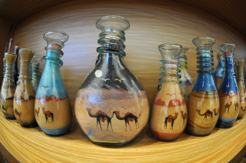 Brothers make sand art bottles at Expo