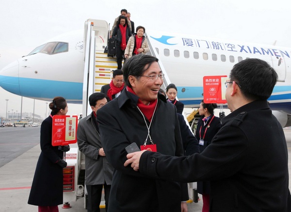 Deputies to 12th NPC arrive in Beijing