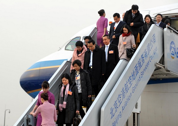 Deputies to 12th NPC arrive in Beijing