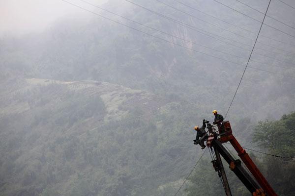 Power line, road repaired to empower quake-hit area