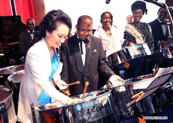 Peng plays steel drum after watching artistic show