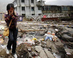 Tears, prays for quake victims on Tomb Sweeping Day