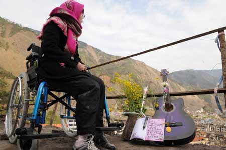 Tears, prays for quake victims on Tomb Sweeping Day