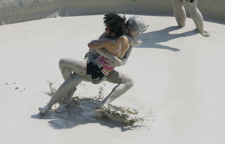 Mud and guts in women's mud wrestling contest