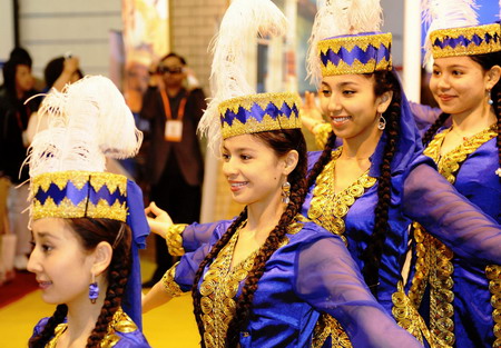 Uygurs perform traditional dancing
