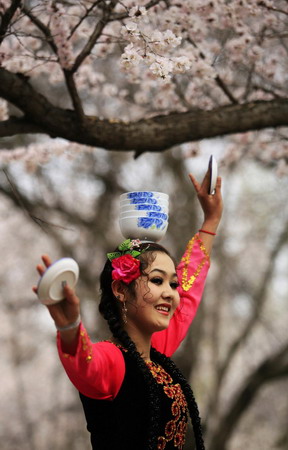 Uygurs perform traditional dancing