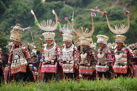 Miao people perform traditional group dance 