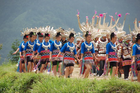 Miao people perform traditional group dance 