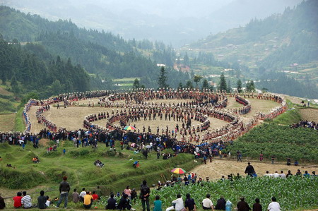Miao people perform traditional group dance 