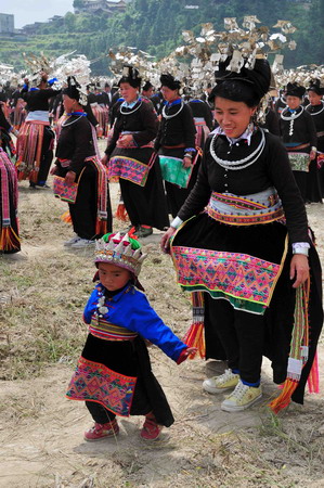 Miao people perform traditional group dance 