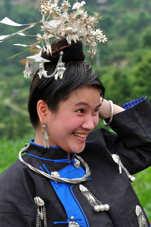 Miao people perform traditional group dance 