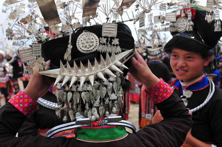 Miao people perform traditional group dance 