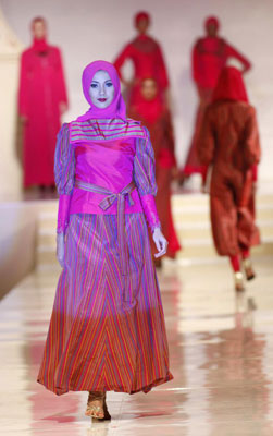 Models present creations by Malaysian designer