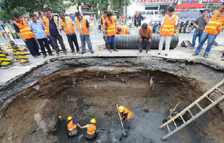 Road sank due to days of rainfall in BJ