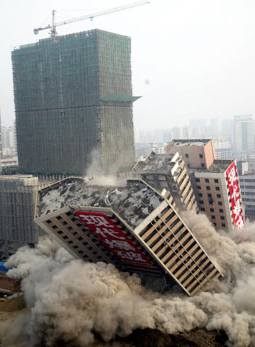 Once landmark tower brought down in planned explosion
