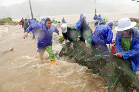 Hotel swept into river after typhoon