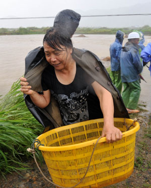 Hotel swept into river after typhoon