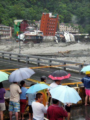 Hotel swept into river after typhoon