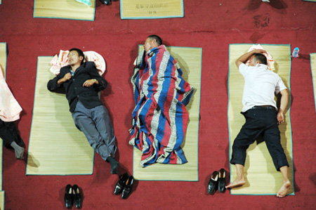 Parents of freshmen students sleep in gym