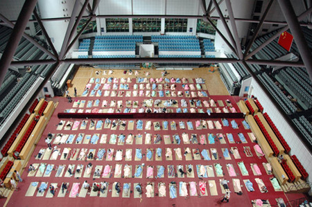 Parents of freshmen students sleep in gym