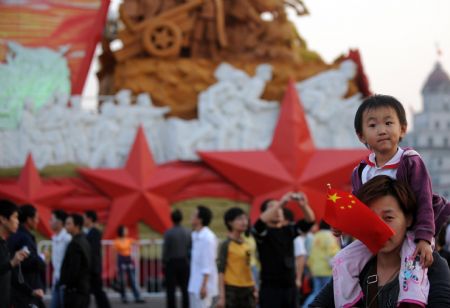 People gather at Tian'anmen Square to view floats