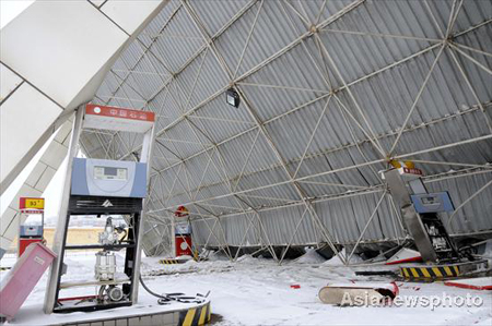 Gas station collapses amid heavy snow