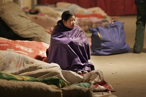 Migrant workers spend nights at temporary shelter