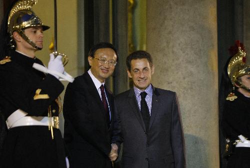 French president meets Chinese FM on ties