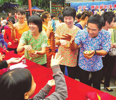 Water-splashing festival reduced to water-sprinkling