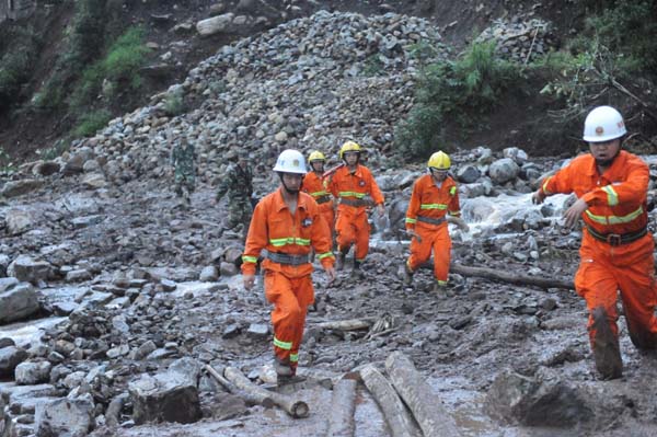 107 people trapped in SW China landslide