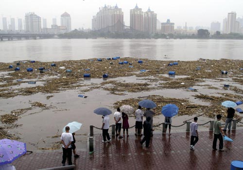 Chemical buckets washed into major river in NE China