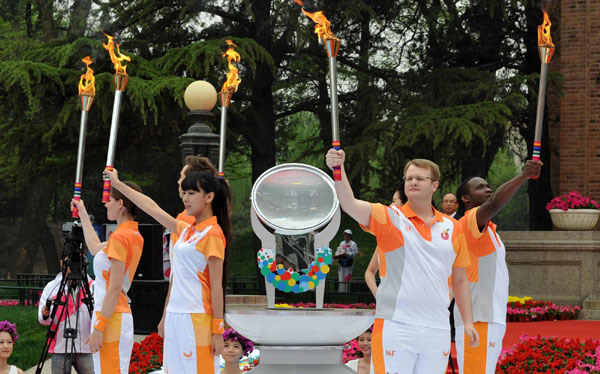 Universiade flame lit in Tsinghua University