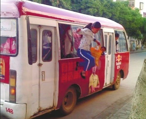 Students jump out through windows of crowded bus