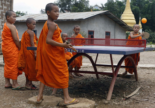 Young monks play table tennis after the Olympics