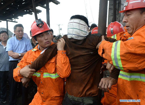 9 rescued, 16 still trapped in flooded China mine