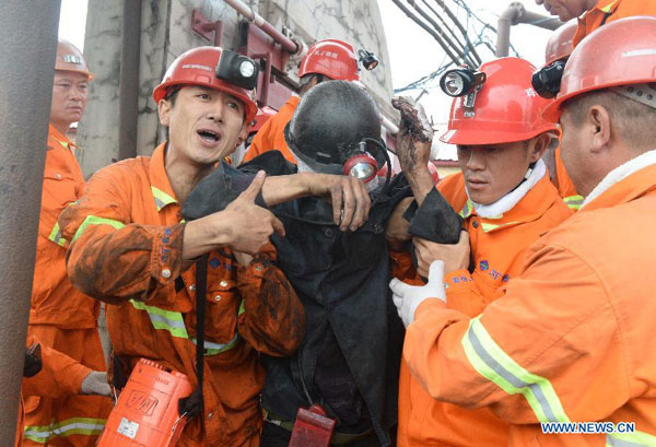 9 rescued, 16 still trapped in flooded China mine