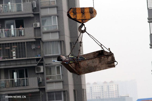 Rescuers save 3 trapped in collapsed building