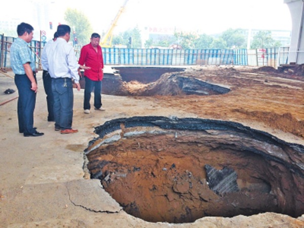 Road cave-in a 14th time in Central China