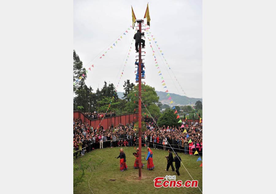 Climbing a ladder of knives to mark Double Third Day festival