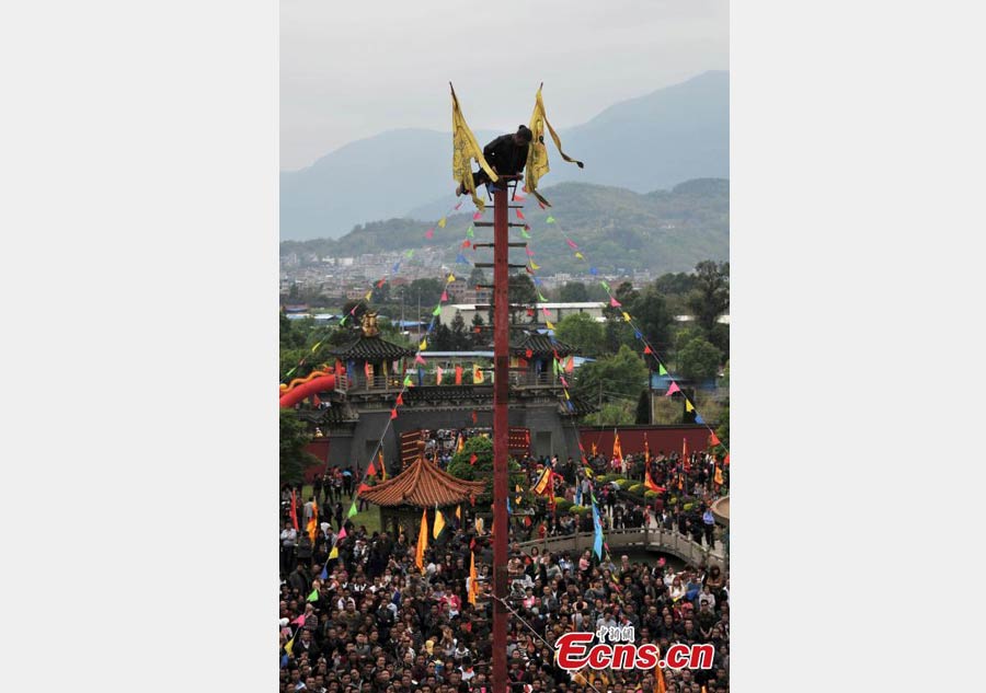 Climbing a ladder of knives to mark Double Third Day festival