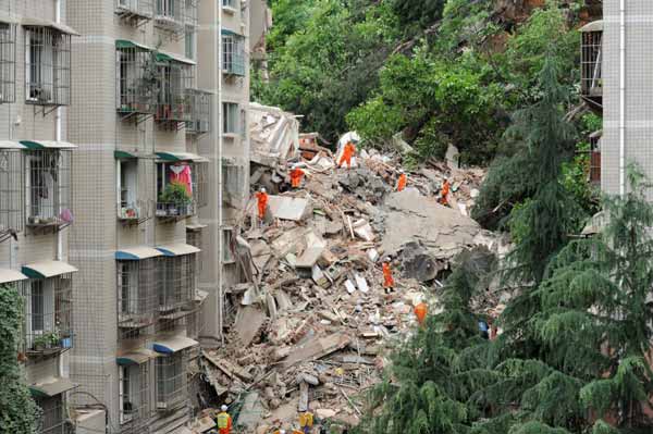 Nine-story building collapses after landslide, 16 missing