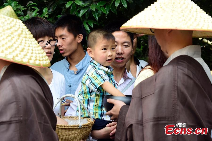 Monks walk for charity on birthday of Buddha