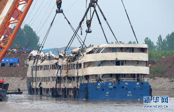 Sunken ship lifted as search for the missing continues