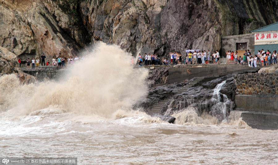 Rescuers help people flee flooding as typhoon hits Zhejiang province