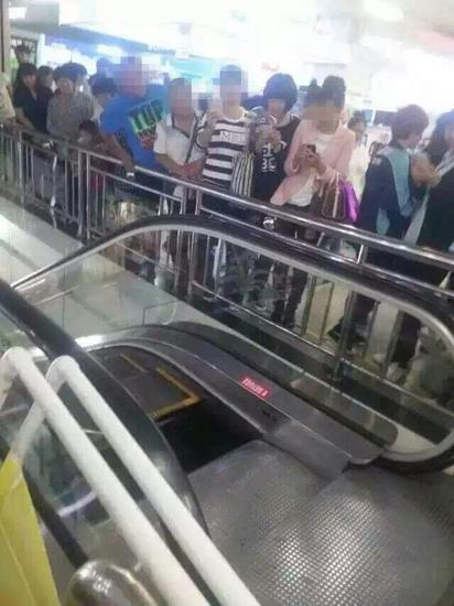 Woman has narrow escape as mall escalator floor collapses