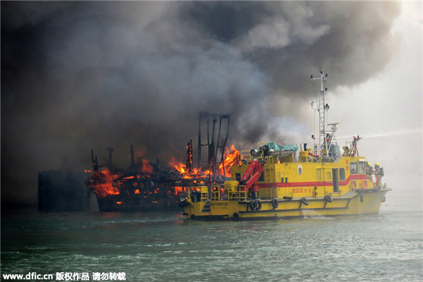 Huge fire sweeps through vessels in Hong Kong's Victoria Harbour