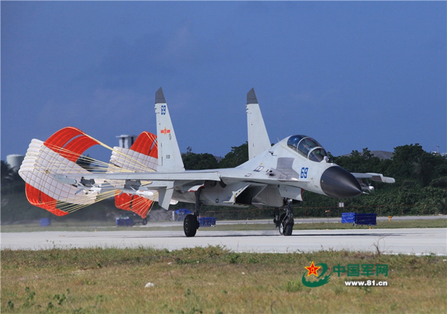 Naval aviation J-11 fighters conduct flight training