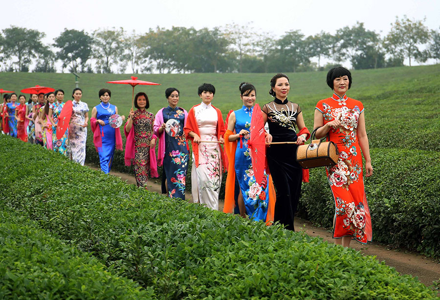 Female officials put on cheongsams to promote village