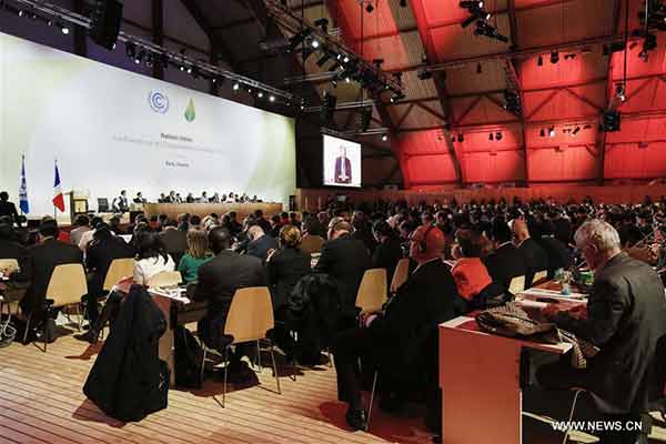 China urges implementation after historic climate deal sealed