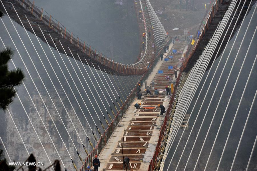 Glass bridge across Zhangjiajie Grand Canyon under construction